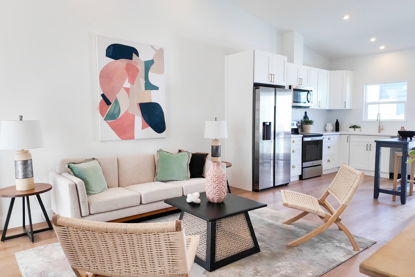 Modern open-concept living space with stylish decor and integrated kitchen in Pacific Beach ADU