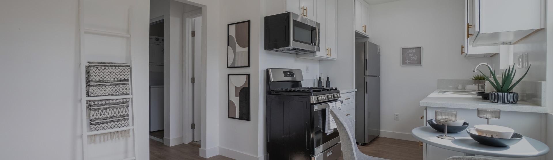 a kitchen with a microwave oven and cabinets