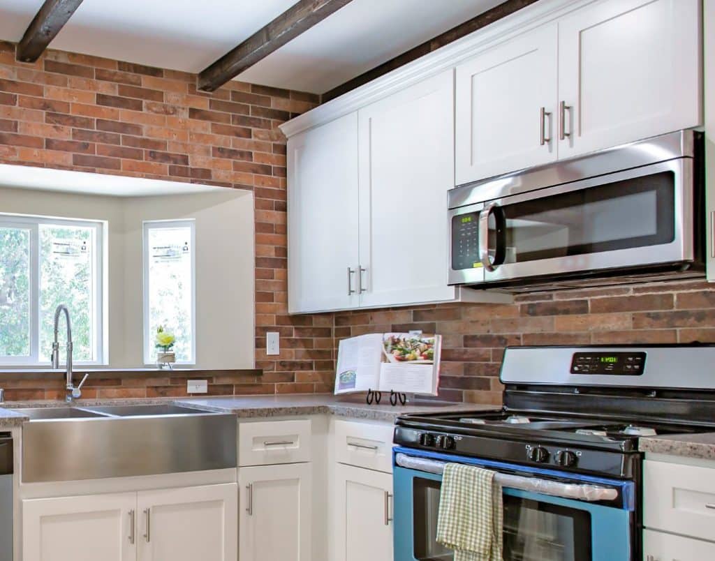 A variety of energy-efficient kitchen appliances including a blender, coffee maker, and toaster in a minimalist setup.