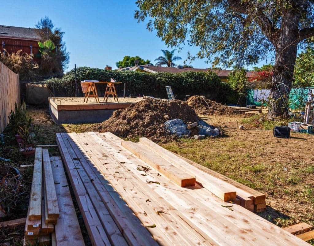 Construction site preparing for ADU development on a sloped lot, showcasing grading challenges.