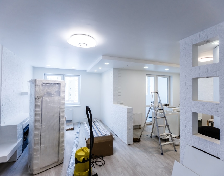 Interior of an ADU in the finishing stages, showing lighting installation and electrical setup in progress. Highlights why proper electrical planning is essential for ADUs in California, ensuring compliance with safety standards, energy efficiency, and adequate power distribution for a comfortable, functional living space.