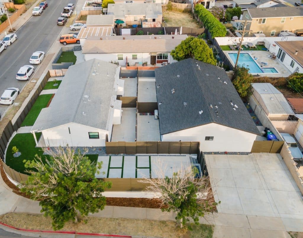 Aerial view of a neighborhood showcasing ADUs alongside primary homes, reflecting the zoning and privacy considerations often faced by ADU owners.