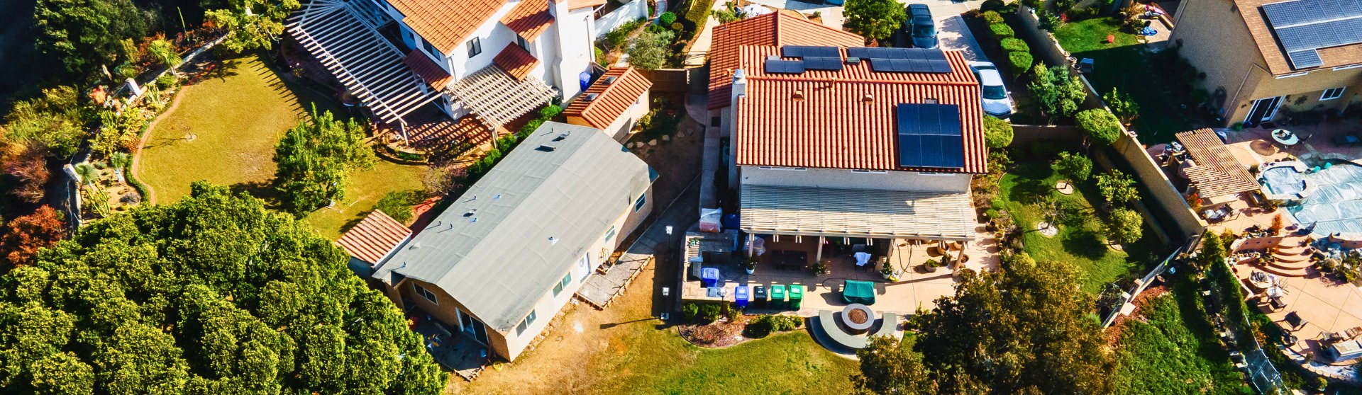 Aerial view of a residential property showing new ADU construction alongside existing structures.