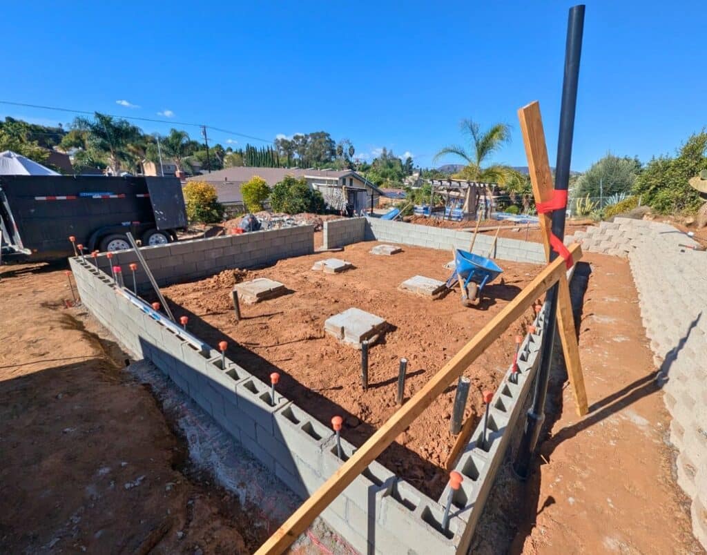 Top-down view of ADU foundation work during early construction stages in San Diego.