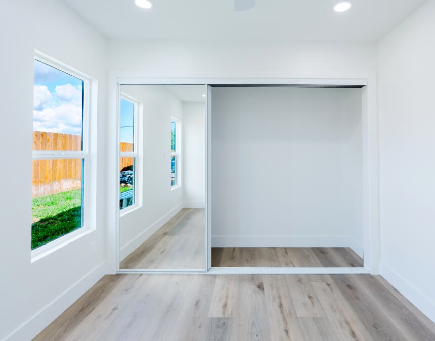 Can a Basement Bedroom Be Legal in California illustrating a basement-style bedroom with windows that support natural light and emergency egress requirements.