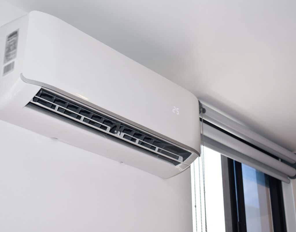 A wall-mounted HVAC unit in a bedroom, providing energy-efficient heating and ventilation, essential for year-round comfort in an ADU.