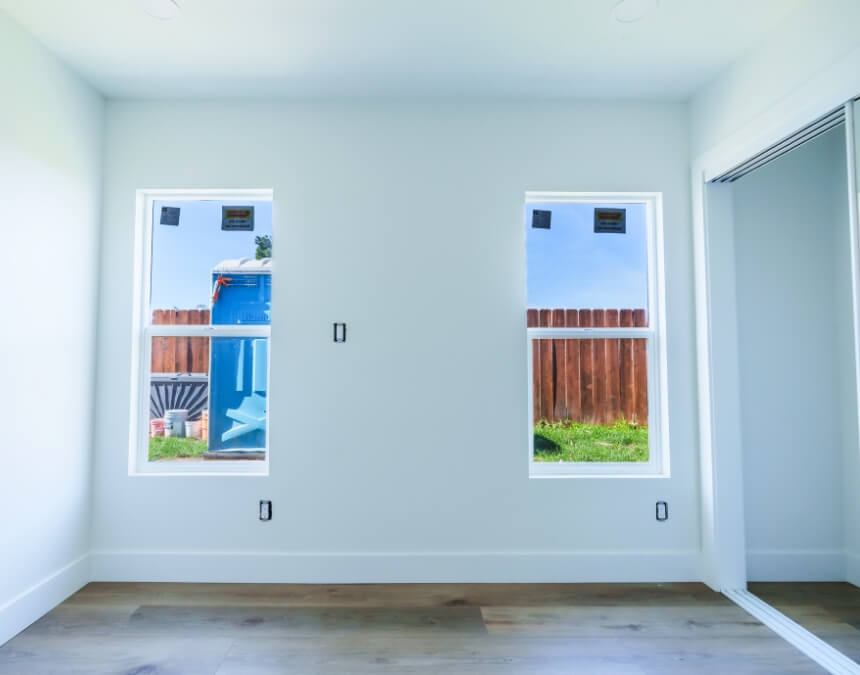 Minimum Window Area Requirements featuring a bedroom with windows that provide natural light and ventilation in accordance with California bedroom standards.