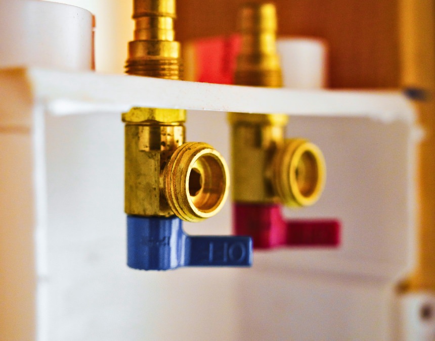 Title 24 water heating requirements - close-up of plumbing connections for energy-efficient water heating systems.