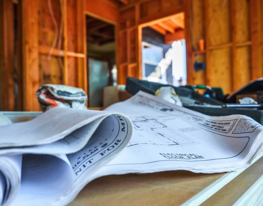 ADU build construction phase reviewing blueprints and materials