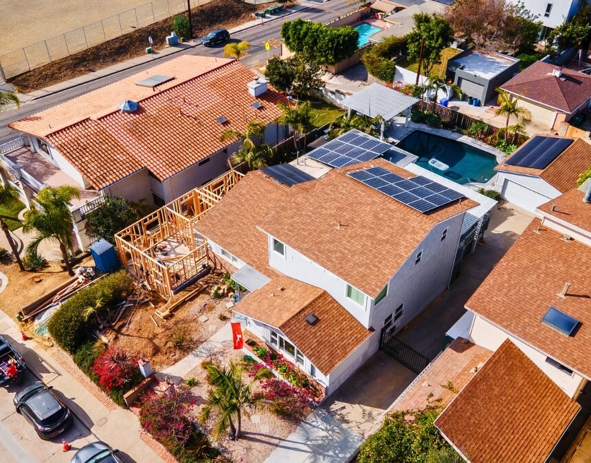 Framed ADU rising beside a primary residence - tied to "How Homeowners Insurance Protects Your ADU."