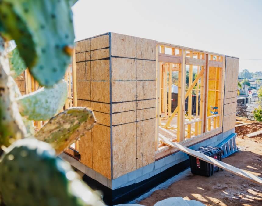 Framed ADU unit under construction beside cactus - found in "Limitations of Homeowners Insurance for ADUs."