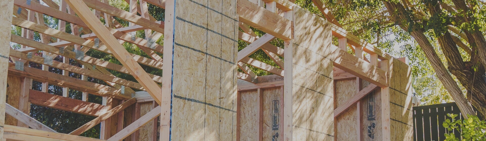 Framed ADU construction in Mission Valley with exposed wood beams and sheathing