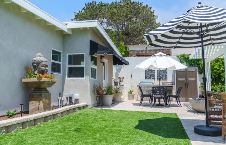 Outdoor patio area of a 600 sq ft ADU with shaded seating and landscaping, used in the "Top FAQs for 600 sqft ADUs" section to illustrate flexible living potential.