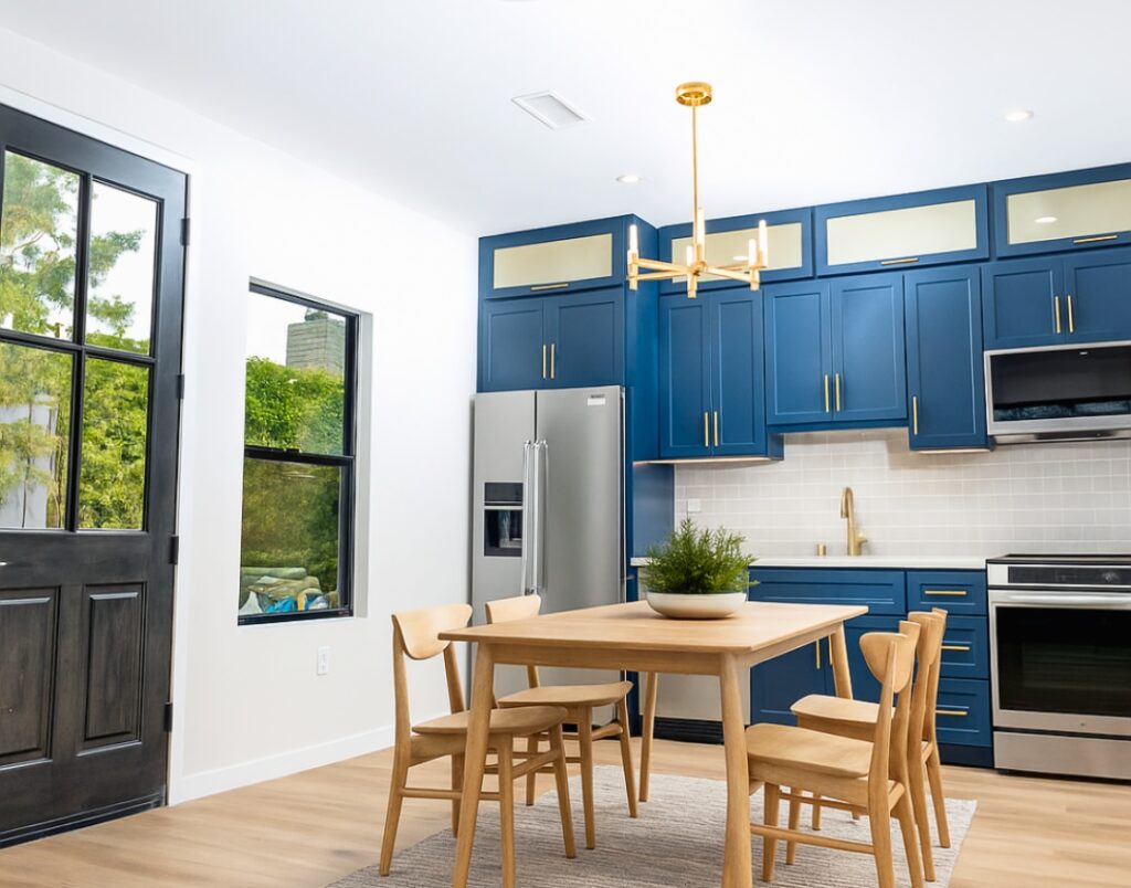 Del Mar Rental Oasis 2 showcasing bold navy cabinetry with warm brass hardware and clean lines.