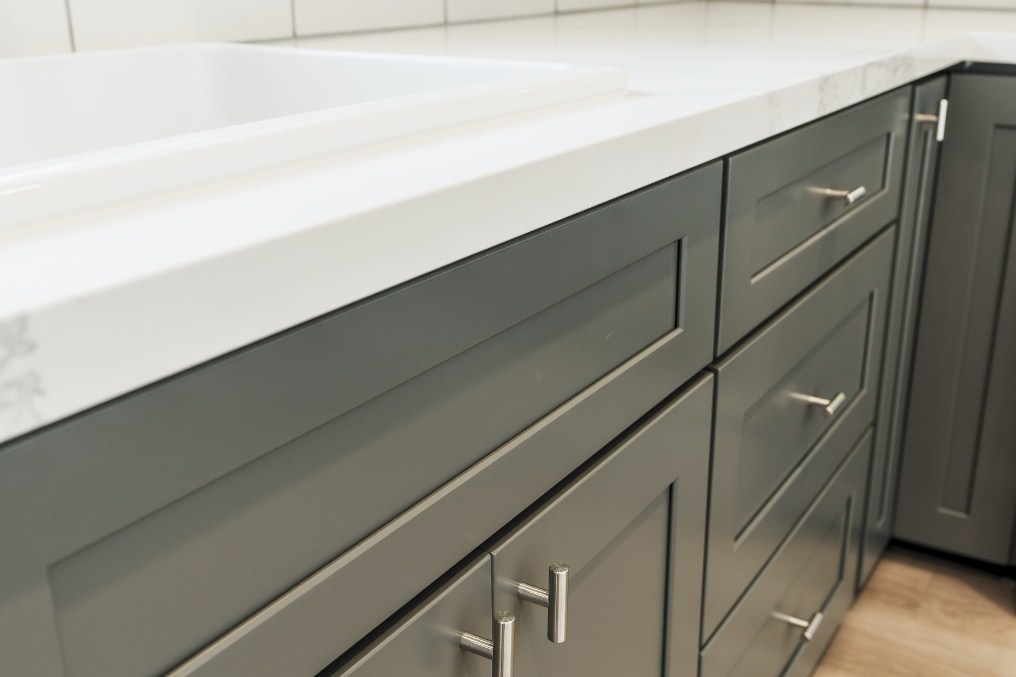 Detail view of sophisticated grey shaker cabinets with brushed silver hardware