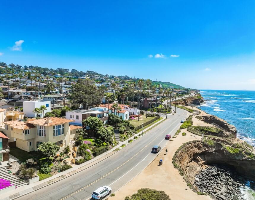 Aerial view of Navigating Local and State Laws with San Diego’s coastal neighborhood and beachside housing.