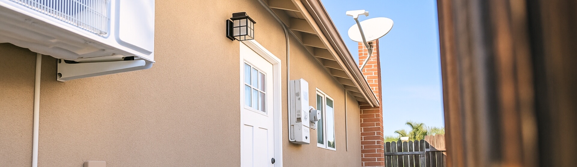 Electrical service panel and utility connections installed for California ADU compliance with building codes.