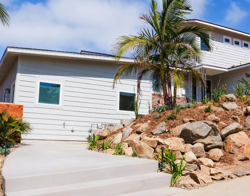 Lifestyle Advantages of ADU Living modern ADU exterior with palm trees and landscaped walkway