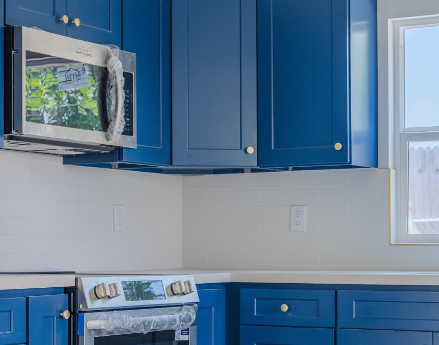 Why a Feasibility Study is Essential for a Successful ADU Project – kitchen interior with blue cabinets installed.