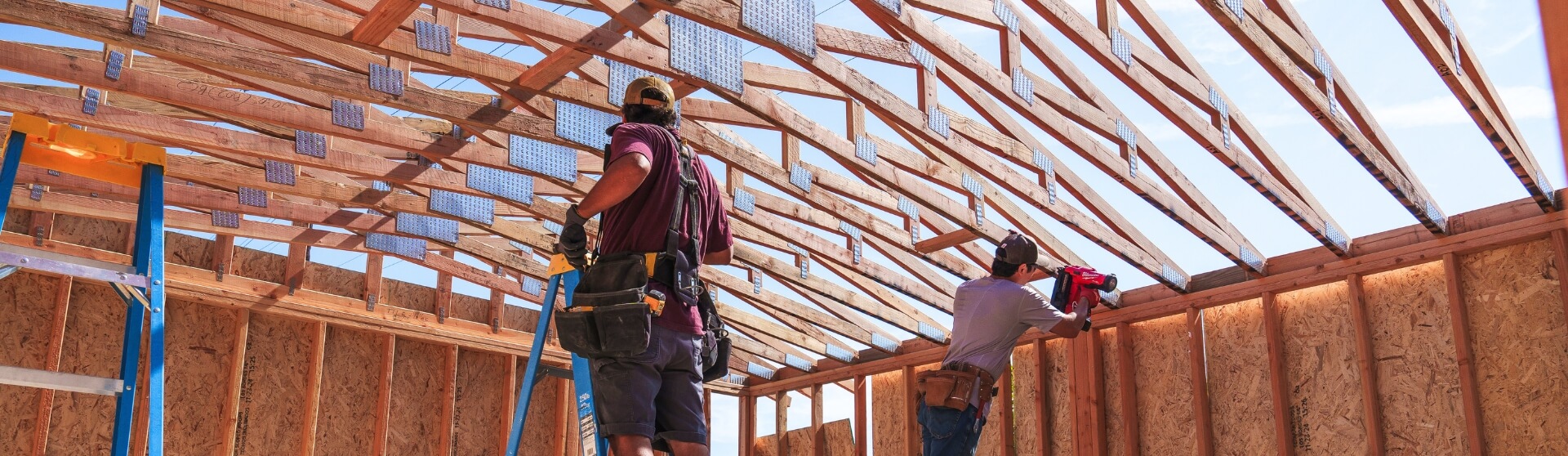 Construction workers framing a detached ADU structure in San Diego, CA during the early building process.