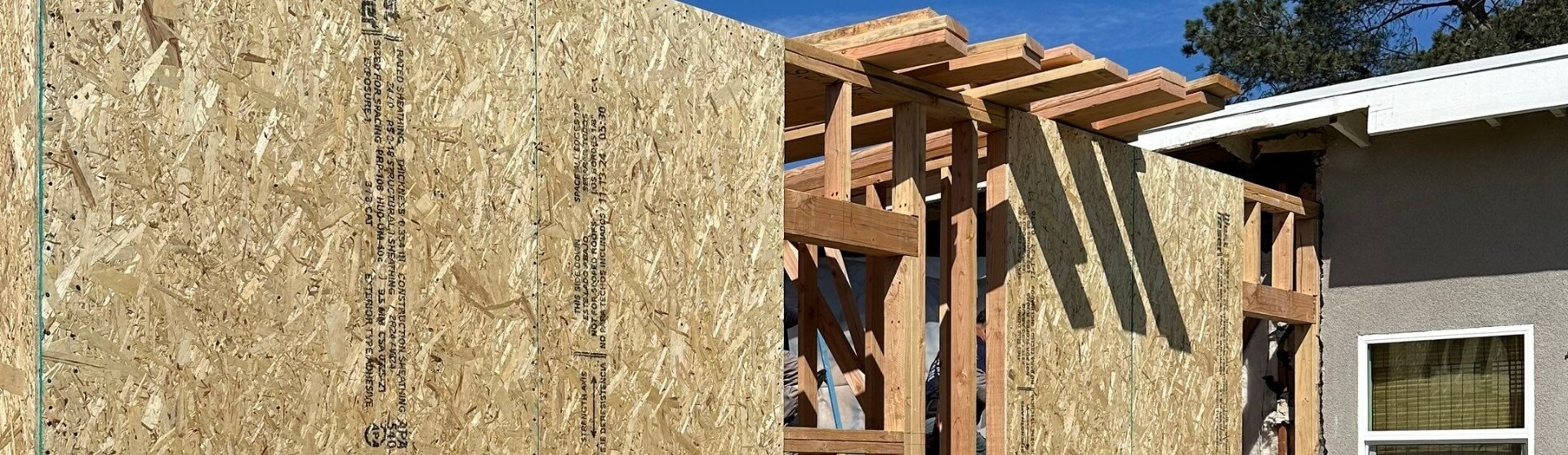 Aerial view of professional ADU construction in San Diego showing framed structure and residential site — Why Choose a Professional ADU Builder in San Diego.