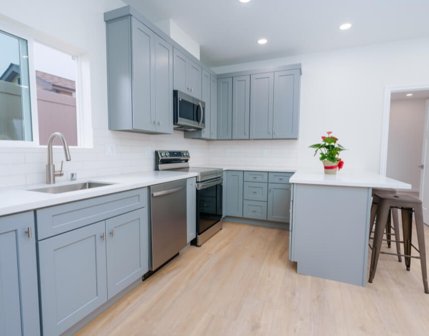 Interior ADU Colors_ Maximizing Space, Light, and Livability – bright ADU kitchen using light cabinetry and reflective surfaces to enhance natural light