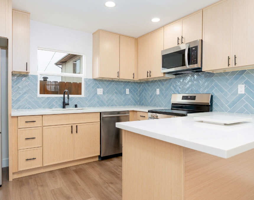 Modern ADU Colors – minimalist ADU kitchen design featuring soft gray cabinetry, white countertops, and clean modern lines