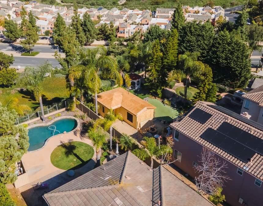ADU Types and Their Permit Cost Differences – backyard detached ADU with pool in California residential property