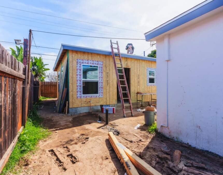 Cost-Saving Strategies for ADU Permits – ADU under construction showing framing and exterior work