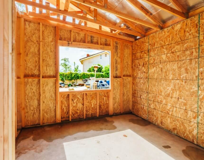 Hidden ADU Permit Costs Homeowners Miss – ADU framing interior showing structural build phase