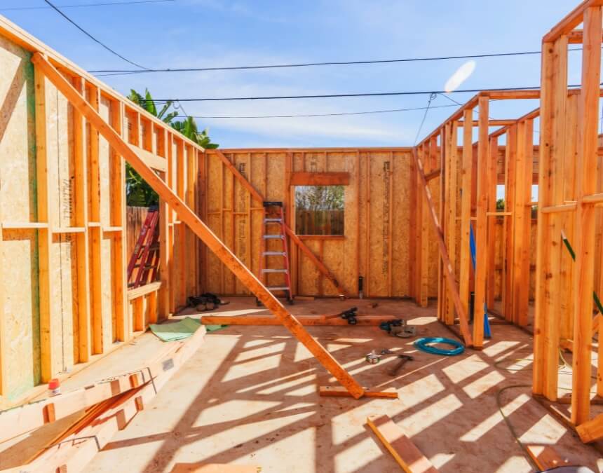 Total ADU Project Costs – interior framing of ADU showing construction phase and cost components