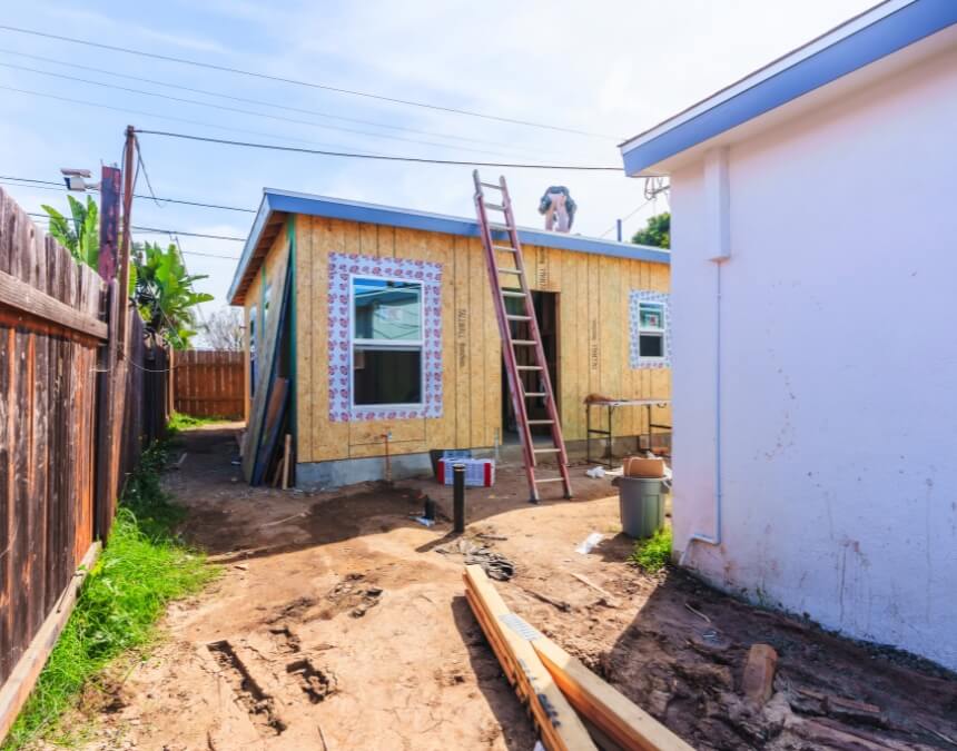 Budget Management Strategies – ADU exterior framing and structural progress showing early build investment stage