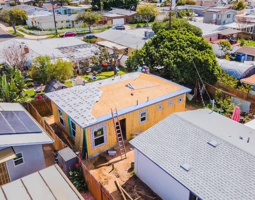 Construction Phase Management – aerial view of ADU framing and roofing progress in residential neighborhood