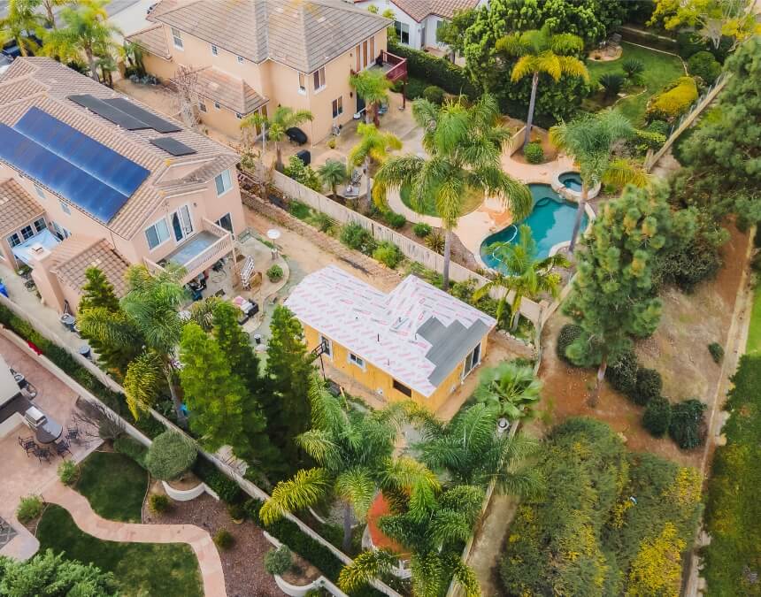 Hard Costs vs. Soft Costs in ADU Construction aerial view of detached ADU framing and site development in California