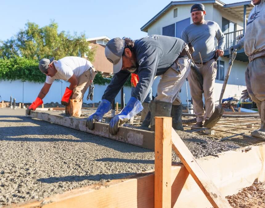 How to evaluate an experienced ADU builder with construction crew preparing foundation during California ADU build