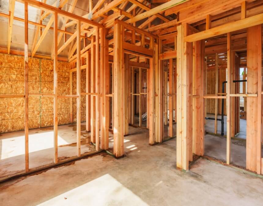 Steps in ADU Project Planning – ADU framing stage with exposed wood structure and layout planning