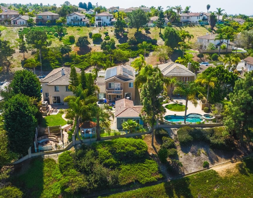 Understanding California ADU laws and regulations with aerial view of hillside residential properties in San Diego