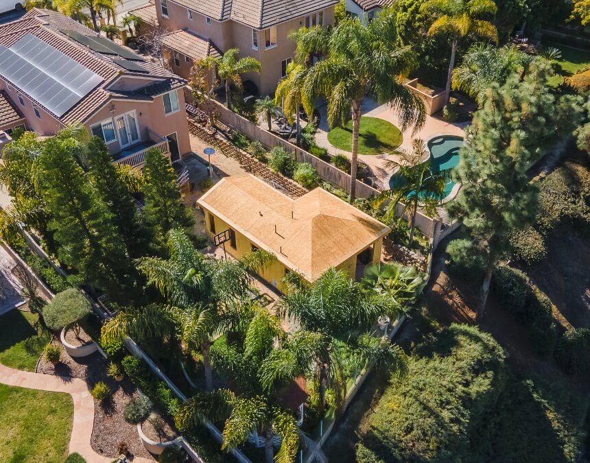 Why ADUs are more popular than ever in California featuring detached backyard ADU in residential neighborhood
