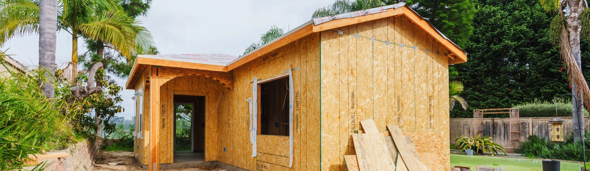 What is the cost of building an ADU in California featuring a detached ADU under construction with framing and exterior sheathing